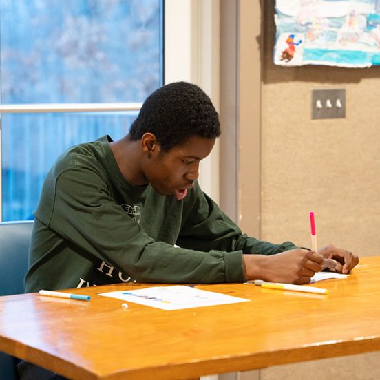 Boy coloring with markers